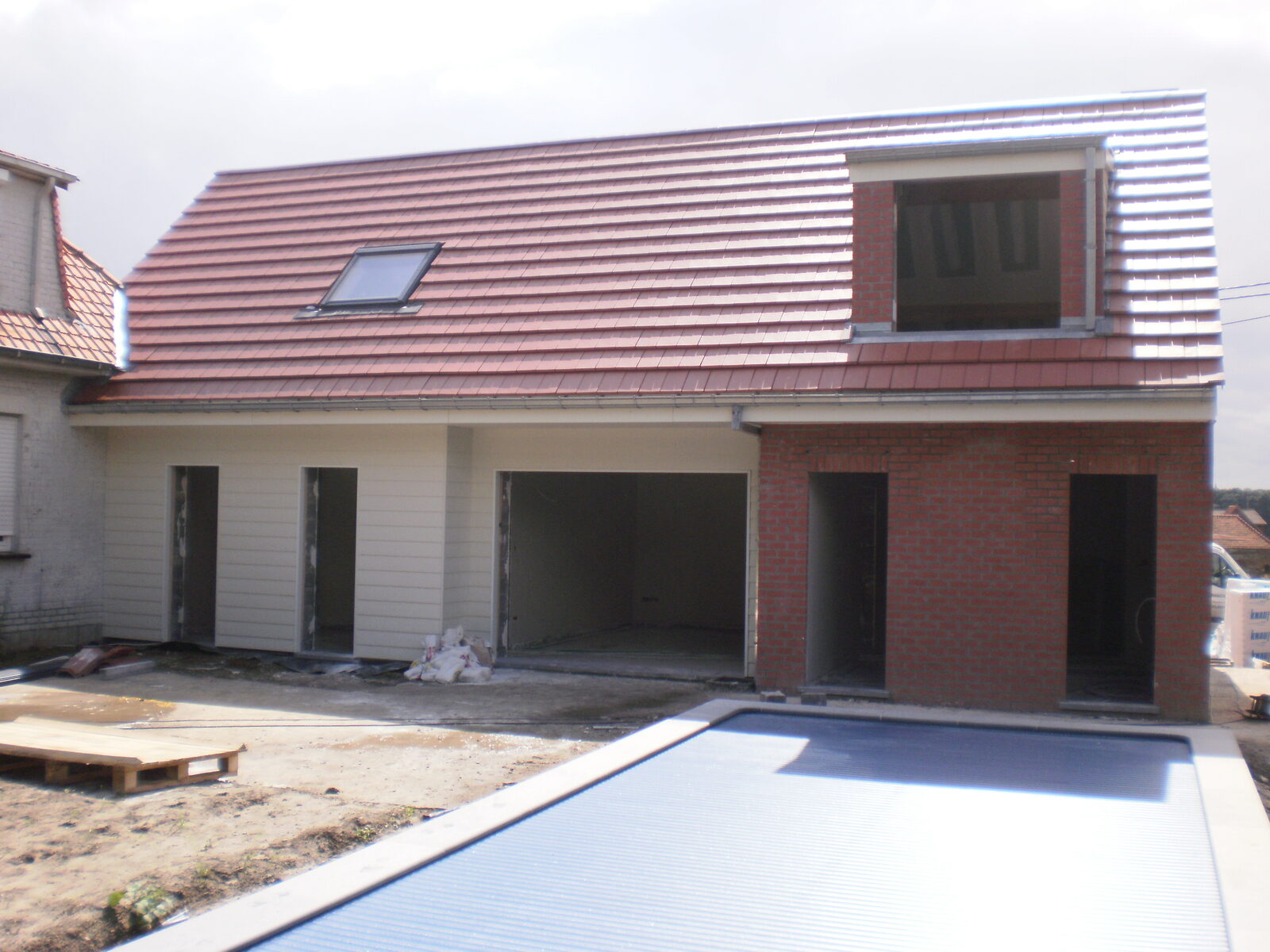 Extension d'une maison unifamiliale avec piscine à Tournai